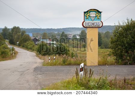 VISIM/ RUSSIA - JUNE 22, 2015. Road sign with the name and coat of arms of the old Russian old believer village Visim. Sverdlovsk region Ural mountains Russia.