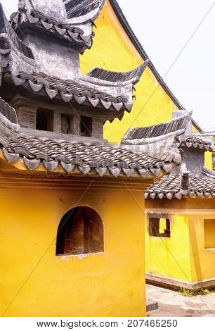 Golden colored Chinese style buildings at the Seventh Master Temple in Xitang Town in Jiashan county Zhejiang Province China.