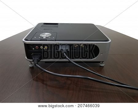 LED projector on wood table in a room projector home theater concept.