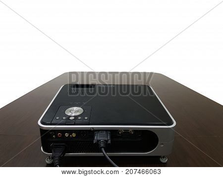 LED projector on wood table in a room projector home theater concept.