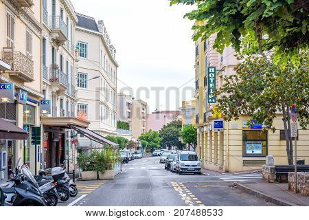 BEAULIEU SUR MER, FRANCE - JUNE 27,2017: Beautiful sunset view to buildings of city. Cloudy day.