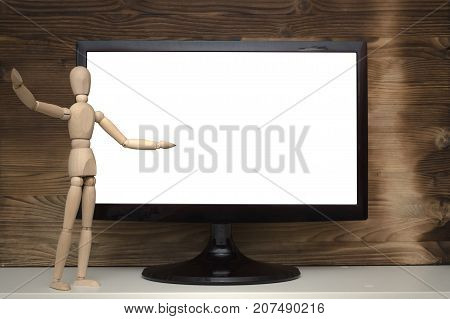 Product presentation. Special offer. Message board. Wooden doll newscaster. Wooden doll and computer monitor with blank screen on wooden wall background. Contact us or feedback form design.