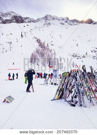 Chamonix, France - January , 24, 2015: People skiing, pile of Skis and slopes view at Les Grands Montets ski area near Chamonix, France