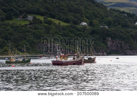 Ullapool Scotland - August 15 2010: Fishing boats in the port of Ullapool in the Highlands in Scotland United Kingdom