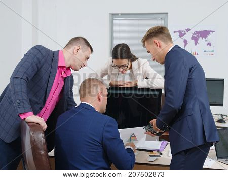 Close-up from the back, business people brainstorm in a new business project. In the office