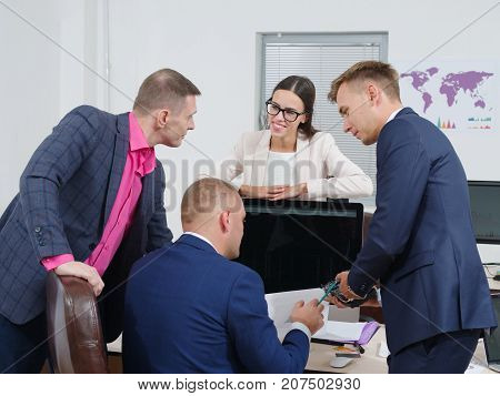 Close-up from the back, business people brainstorm in a new business project. In the office