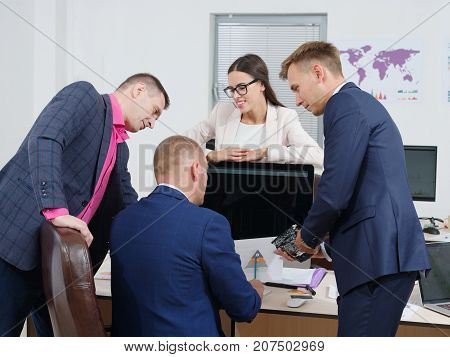 Close-up from the back, business people brainstorm in a new business project. In the office