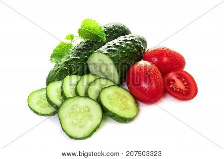 Cucumbers and tomatoes on a white background