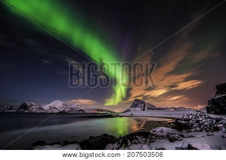 Aurora borealis. Northern lights activity at Stor Sandnes beach