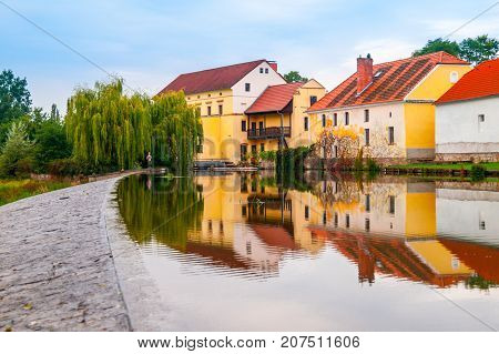 Old mill reflected in the water, Putim, Southern Bohemia, Czech Republic.