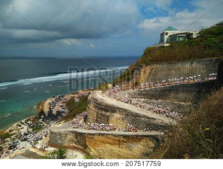 Hindu Balinese purification ceremony and ritual near Melasti beach Bali. Top aerial view of beauty Bali beach