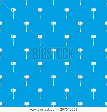 Mobile phone on a selfie stick pattern repeat seamless in blue color for any design. Vector geometric illustration