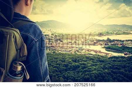 Girl with backpack viewing environment of phuket Travel concept.