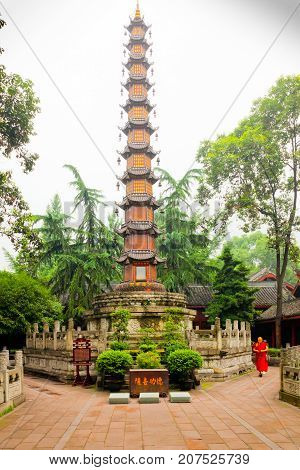 Sichuan July 2011 - In July many visitors come to see this buddhist temple to pray and enjoy also its religious atmosphere and well kept garden meeting the monks living there