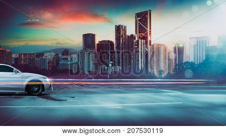 Sport car on roadside with night scene near the modern city background .