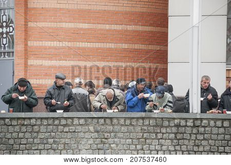 KIEV (KYIV), UKRAINE,November 11,2013: Charity. Homeless people eat a free lunch