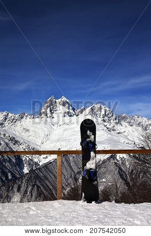 Snowboards In Outdoor Cafe At Ski Resort At Sun Winter Day