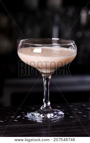 Baileys liqueur in glass on dark background. bar alcohol cocktail menu Milk liqueur. evening club concept