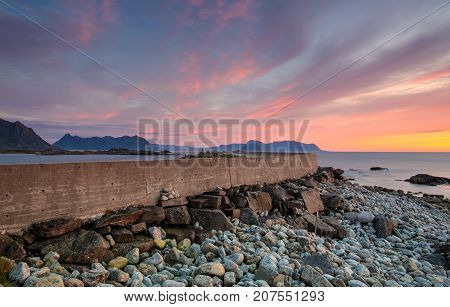 On the pier in Laukvik at sunset Lofoten islands Nordland Norway. HDR Image