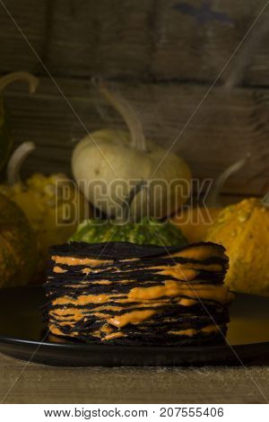 Halloween cake of pancakes on a background of scenery Hallowee