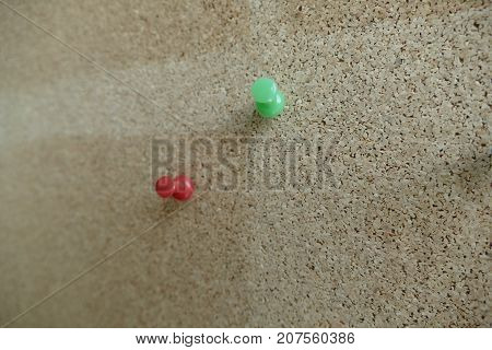 Colored Pin In An Office Pinboard