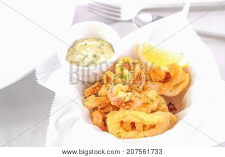 Crispy fresh squid with cream and lemon