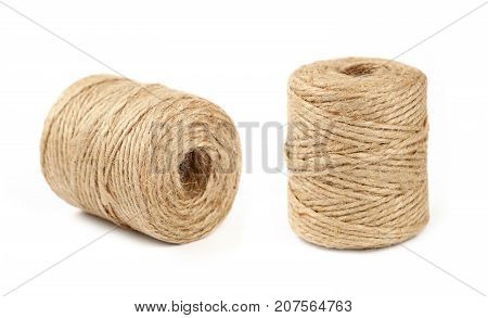 Two Coil Bobbins Of Burlap Jute Twine Over White