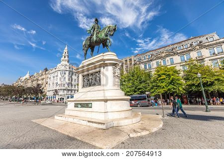 Porto, Portugal - August 11, 2017: equestrian bronze statue of king Dom Pedro IV at Praca da Liberdade or Freedom Square in Avenidas dos Alidaos, Oporto historic center in a sunny day.