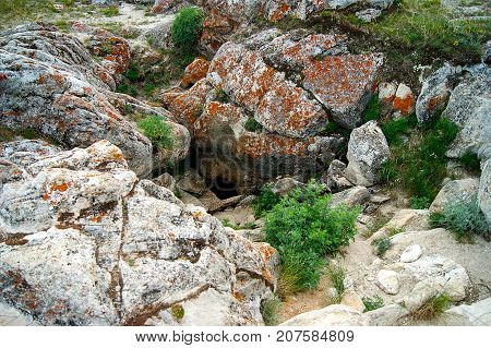 Small entry of a big cave in Tangerian steppes near lake Baikal, Russia