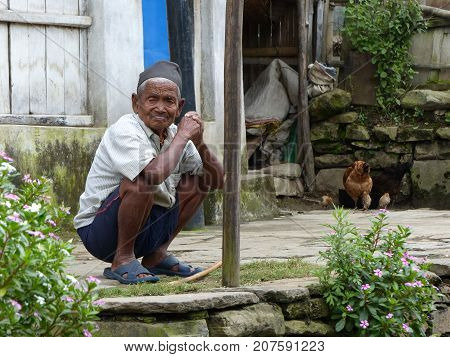 Bahundanda Nepal september 6 2015: Old Nepalese man sitting on the floor