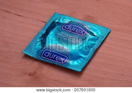 Almere, The Netherlands - October 6, 2017: Durex condom against a wooden background.