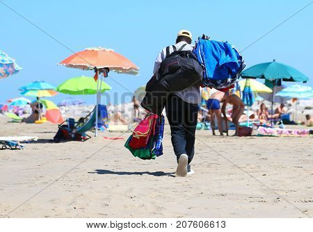 African Towel And Shorts Seller In The Resort Beach