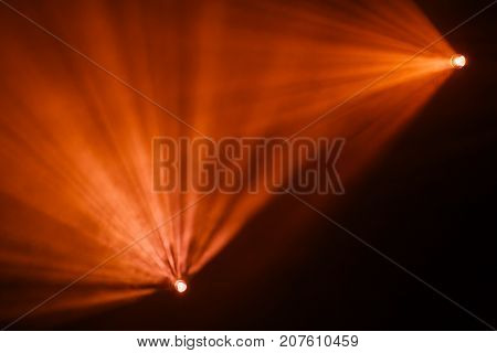 Rays theatrical spotlights on the stage during the performance. Lighting equipment. The lighting designer. Theatrical smoke. The art and creativity.