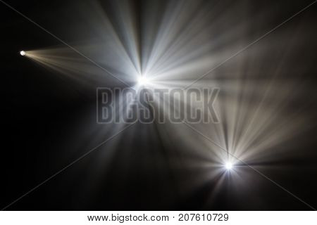 Rays theatrical spotlights on the stage during the performance. Lighting equipment. The lighting designer. Theatre arts