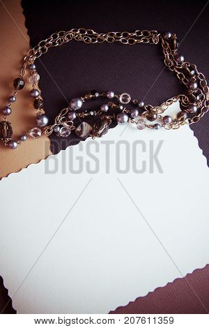 elegant background with dark neutral colors with brush feater and postcard