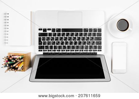 White Desktop With Laptop And Smartphone