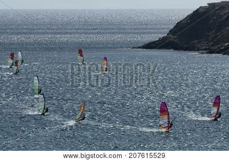 Windsurfers on the waves of the Mediterranean sea at Cape Prasonisi Rhodes (Greece)