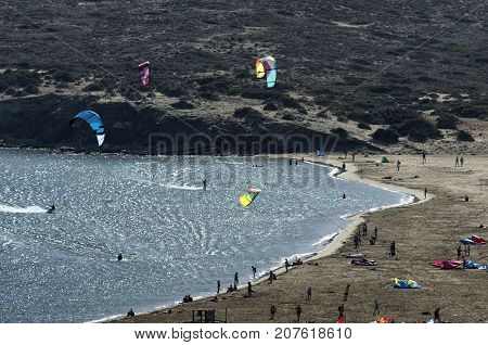 Kitesurfers on the waves of the Mediterranean sea at Cape Prasonisi (Greece)