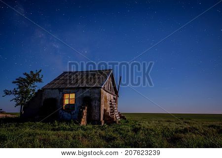 Abandoned haunted house for night horror scene with milky way