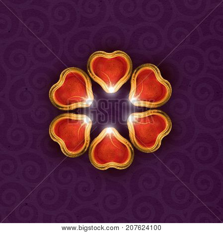 Stock photo of diwali greeting card showing illuminated diya or oil lamp or panti with copyspace