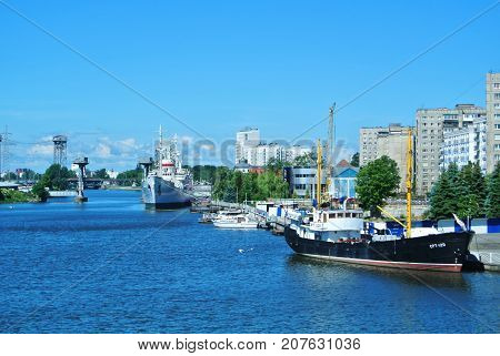KALININGRAD RUSSIA - JUNE 14 2017: A view to a city embankment and ships at the exibition of the Museum of World Ocean.