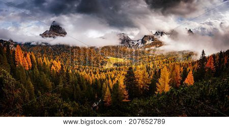 Stunning image of the alpine wallpaper. Dramatic scene, gloomy weather. Location famous place National Park Tre Cime di Lavaredo, Misurina, Dolomiti alps, South Tyrol, Italy, Europe. Beauty world.