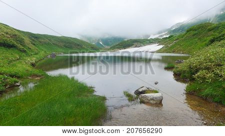 pond on mountaintop Tateyama Kurobe Alpine Japan