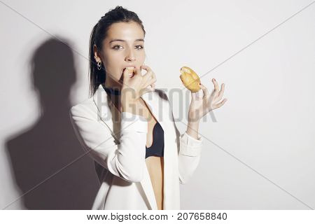 Brunette Girl With A Classic Glase Donut.