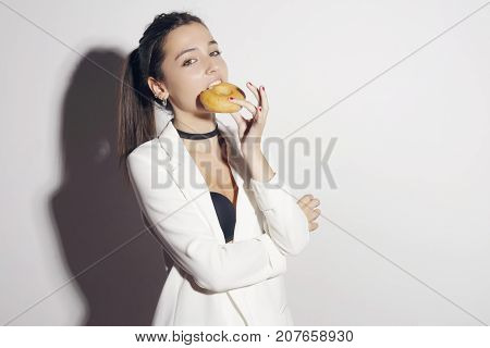 Brunette Girl With A Classic Glase Donut.