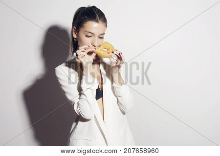 Brunette Girl With A Classic Glase Donut.