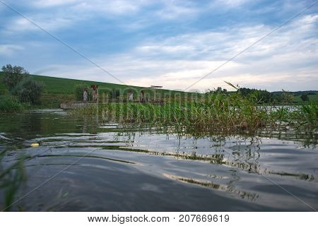 Summer cloudy day on a pond landscape