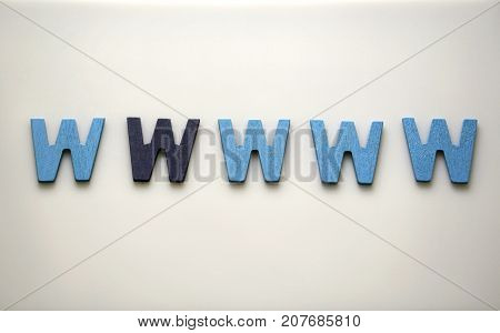 Dark blue W Alphabet letters of the English alphabet are lined on white background with empty space. Differrence in color concept.