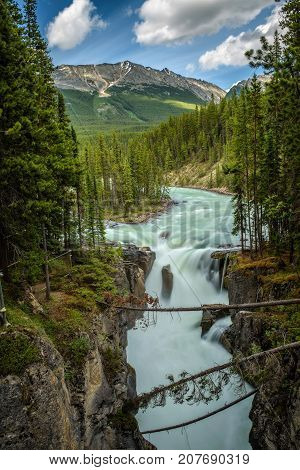 Upper Sunwapta Falls in Jasper National Park, Canada. The water originates from the Athabasca Glacier. Long exposure.