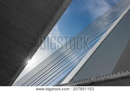 The bridge is made of concrete hanging in the sun and the sky
